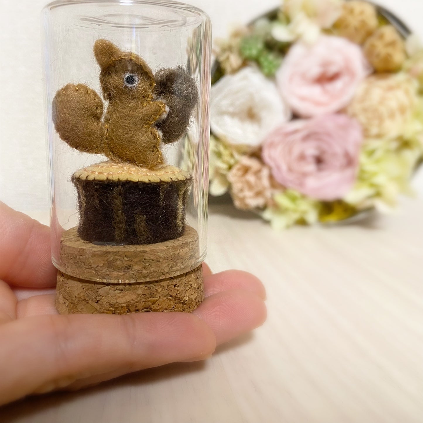 Baby squirrel in a glass bottle