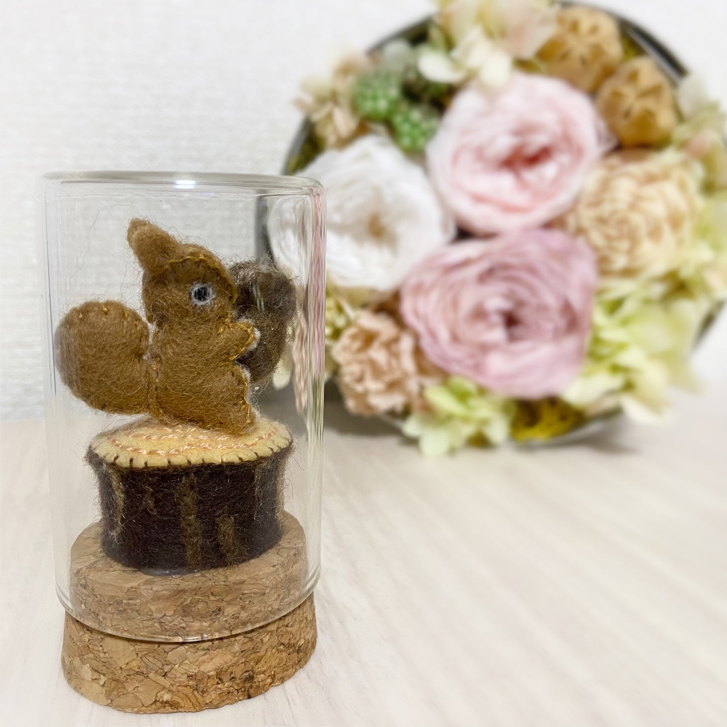 Baby squirrel in a glass bottle